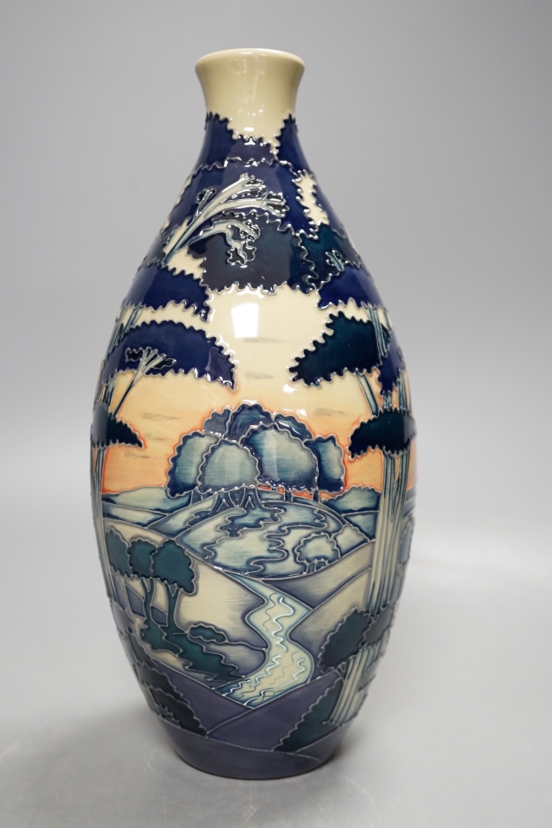 A Moorcroft 'trees in a landscape' trial vase, boxed, 23cms high.
